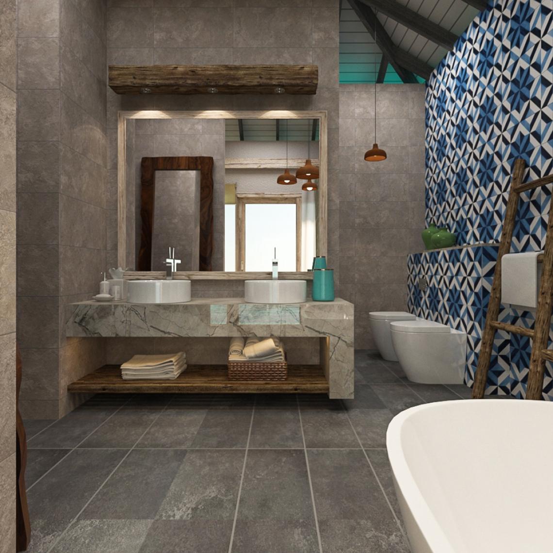 Modernes Badezimmer mit grauen Fliesen und blauen Mustern, zwei Waschbecken und Toiletten
