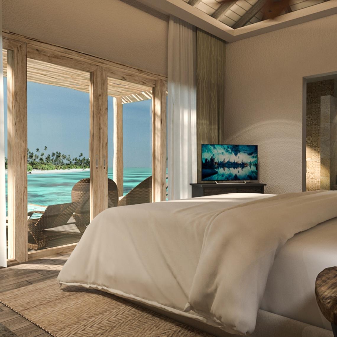 Schlafzimmer mit Meerblick im You & Me Maldives Hotel, mit Fernseher und Balkon.