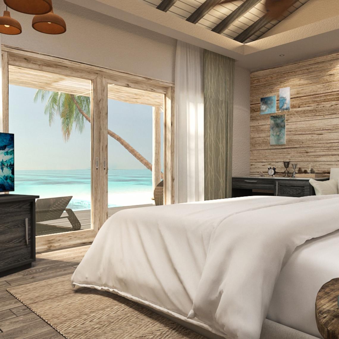 Schlafzimmer mit Meerblick im You & Me Maldives Hotel, zeigt ein großes Bett mit weißen Laken.