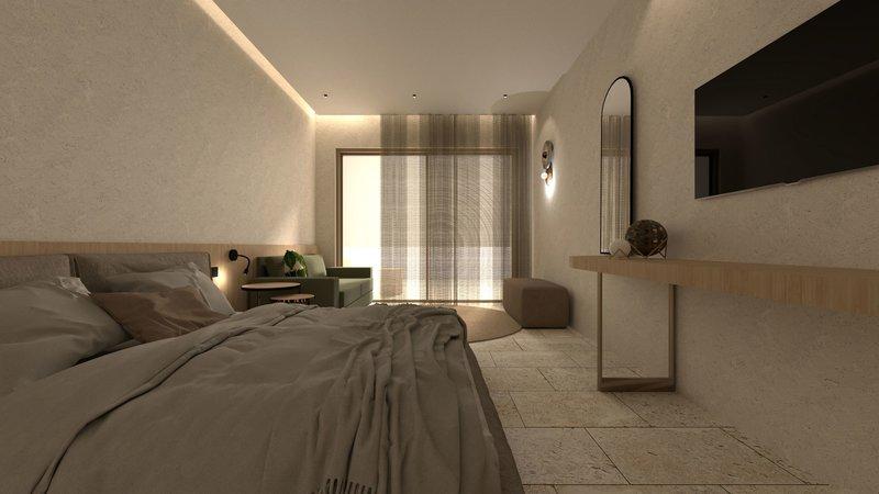 Innenansicht eines Schlafzimmers im Alexandra Beach Resort mit Doppelbett, Couch, Fernseher und Tisch