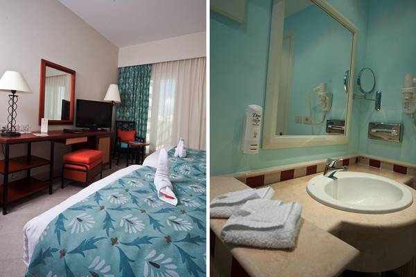 Fanadir Hotel El Gouna Badezimmer mit Waschbecken, Handtüchern und Spiegel