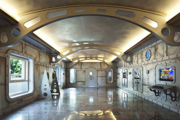 Innenraum des Roca Nivaria Gran Hotel mit futuristischem Design, runden Fenstern und einer Spielkonsole.