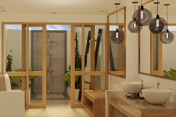 Innenansicht eines Badezimmers im Ellaidhoo Maldives by Cinnamon mit Holztüren, Dusche und zwei Waschbecken.