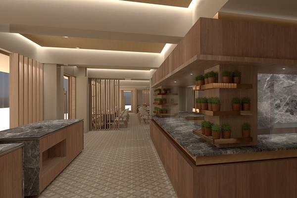 Innenansicht der Rezeption des Akasha Beach Hotel & Spa mit Holzelementen und Marmortheke.