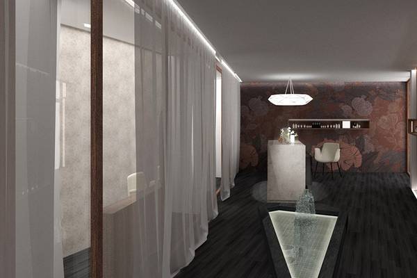 Innenbereich des Akasha Beach Hotel & Spa mit dunklem Boden, weißen Vorhängen und Holzelementen.