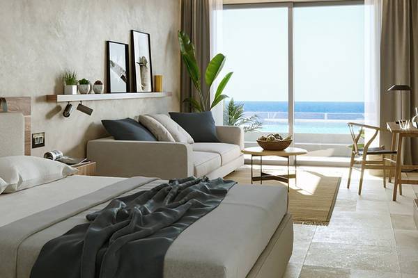 Schlafzimmer des Akasha Beach Hotel & Spa mit Blick auf das Meer