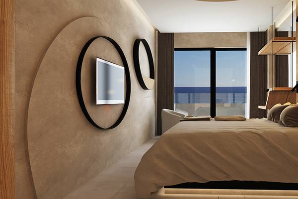 Innenansicht eines Schlafzimmers im Faro, a Lopesan Collection Hotel mit Blick auf das Meer.