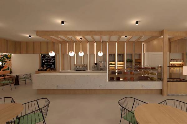 Innenansicht des Cafés im Sunscape Dominicus La Romana mit modernen Holzmöbeln, einer Theke und Tisch-Sets.