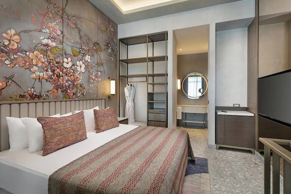 Hotelzimmer im Cullinan Belek mit Bett, Dekor und Badezimmer.