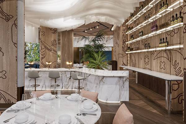 Innenraum des Gloria Serenity Resorts mit Esstisch, Bar und modernen Möbeln.