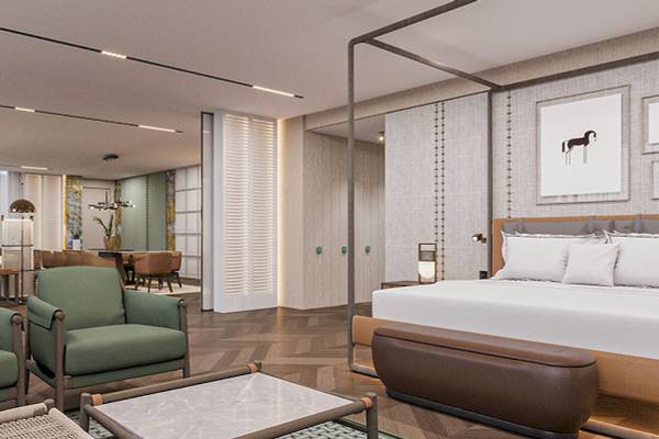 Innenansicht des Schlafzimmers im Gloria Serenity Resort mit modernem Bett, Sitzmöbeln und dekorativen Elementen.