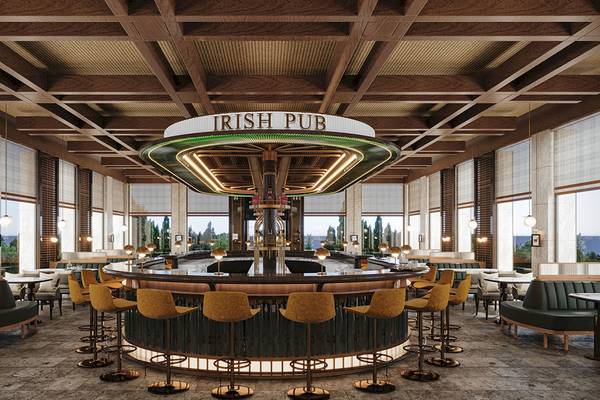 Innenansicht des Irish Pub im Gloria Serenity Resort mit Bar, Sitzgelegenheiten und großen Fenstern.