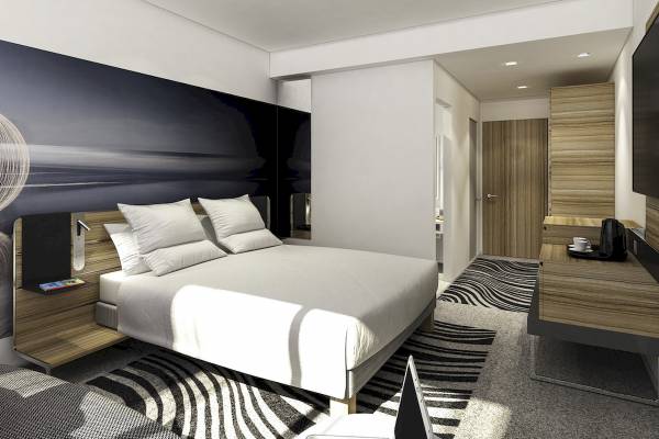 Schlafzimmerdesign im Novotel London Canary Wharf mit moderner Einrichtung.
