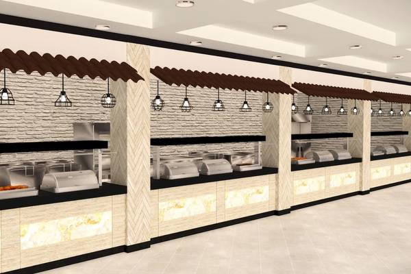 Innenansicht des Buffetbereichs im Sunrise Queen Luxury Hotel mit mehreren Edelstahl-Buffetstationen, braunen Dächern und Beleuchtung.