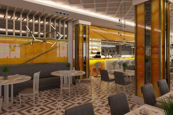 Innenansicht des Restaurants im Sunrise Queen Luxury Hotel mit modernen Möbeln und gelben Wänden.