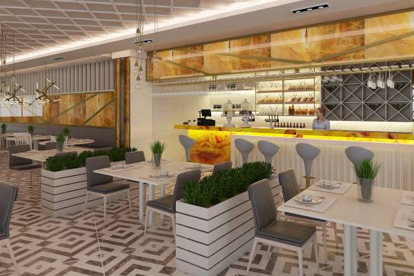 Innenansicht des Restaurants des Sunrise Queen Luxury Hotel mit weißen Tischen, Stühlen und einer Theke.