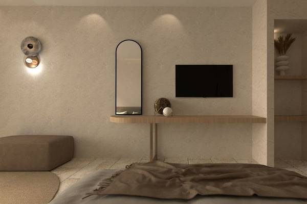 Ein modernes Zimmer im Alexandra Beach Resort mit einer weißen Wand, einem großen Spiegel, einem Fernseher und einem kleinen Tisch.