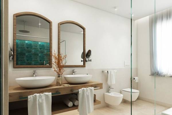 Badezimmer im Almar Timi Ama Resort & Spa mit zwei Waschbecken, Spiegeln und Dusche