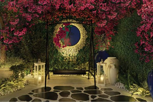 St. Regis Doha Garten Sitzecke mit geschwungener Bank und Blumen