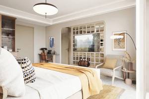 Innenansicht eines Schlafzimmers im Cactus Village Hotel mit Bett, Sessel, Schreibtisch und Fernseher.