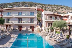 Außenansicht des Cactus Village Hotel & Bungalows mit Pool und Terrasse