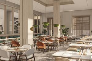 Innenansicht des Restaurants im Jaz Elite Amara Hotel mit runden Tischen und Stühlen, grünen Pflanzen und Kronleuchtern.