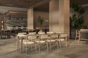 Innenansicht des Jaz Elite Amara Restaurants mit gedeckten Tischen und Stühlen, Holzsäulen und Pflanzen.