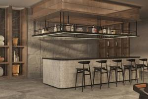 Innenansicht der Bar im Jaz Elite Amara Hotel mit einer Theke und Stühlen.