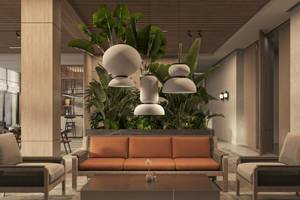 Lobby des Jaz Elite Amara Hotels mit Sofa, Sesseln und Pflanzen