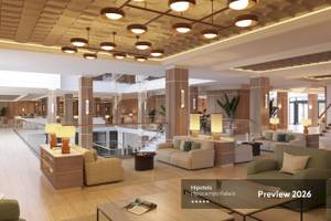 Lobby-Bereich des Hipotels Hipocampo Palace mit modernen Möbeln und Pflanzen.