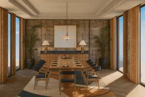 Essenbereich im Atlantica Kalliston Resort mit Esstisch, Stühlen und Pflanzen.