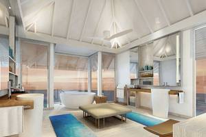 Luxuriöses Badezimmer im LUX South Ari Atoll Hotel mit Badewanne und offenem Ausblick auf den Ozean.