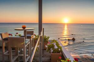 Corissia Princess Terrasse mit Meerblick bei Sonnenuntergang