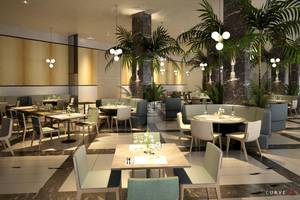 Innenansicht des NissiBlu Beach Resort Restaurants mit modernen Möbeln und tropischen Pflanzen.