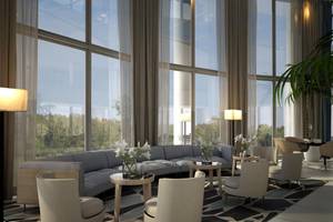 Loungebereich des NissiBlu Beach Resort mit Sofas, Tischen und Pflanzen