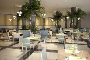 Innenansicht des Restaurants im NissiBlu Beach Resort mit Tischen, Stühlen und Pflanzen