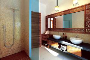 Badezimmer im Bahari Zanzibar Hotel mit Regendusche und doppeltem Waschbecken.