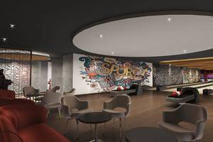 Moderne Bowlingbahn im Delphin BE Grand Resort mit bunten Graffiti und bequemen Sitzgelegenheiten.