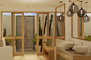Innenansicht eines Badezimmers im Ellaidhoo Maldives by Cinnamon mit Holztüren, Dusche und zwei Waschbecken.