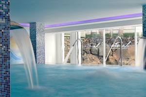 Wellnessbereich des Alexandre Hotel Troya mit Wasserbecken und Steinwand.