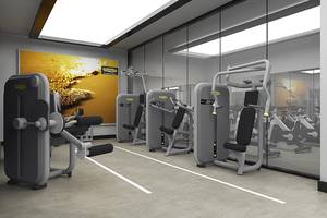 Fitnessraum im Rixos Premium Seagate mit moderner Fitnessgeräten und einer großen Wandmalerei.