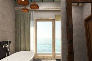 Badezimmer mit Meerblick im You & Me Maldives Hotel mit Badewanne und Glastür.