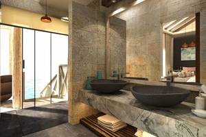 Badezimmer mit Doppelwaschbecken und Meerblick im Hotel You & Me Maldives.