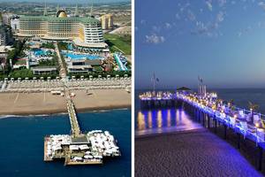 Luftaufnahme des Delphin Imperial Hotels mit Strand und Pier bei Sonnenuntergang