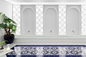 Badezimmer der Katikies Villas Mykonos mit blau-weißen Fliesen und Pflanzen.