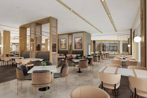 Innenansicht des Restaurants im Lago Hotel mit runden Tischen und Stühlen.