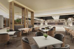 Das Interieur des Lago Hotels zeigt ein modernes Restaurant mit weißen Tischen und Stühlen.