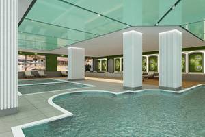 Innenpool im Lago Hotel mit grünen Wänden und weißen Säulen.