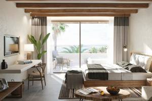 Hotelzimmer im JAZ Riviera mit Blick auf das Meer und eine Terrasse.